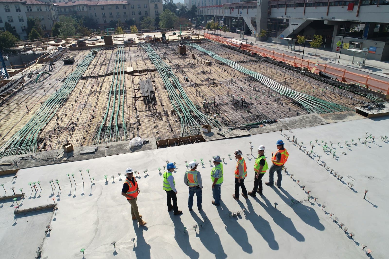 Commercial construction site with crew reviewing a build